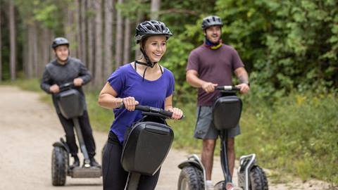 a group of people riding segways