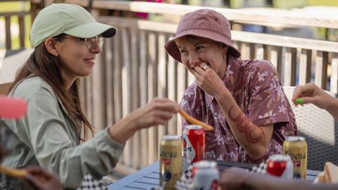 Two women eating and drinking at Blue Mountain Resort