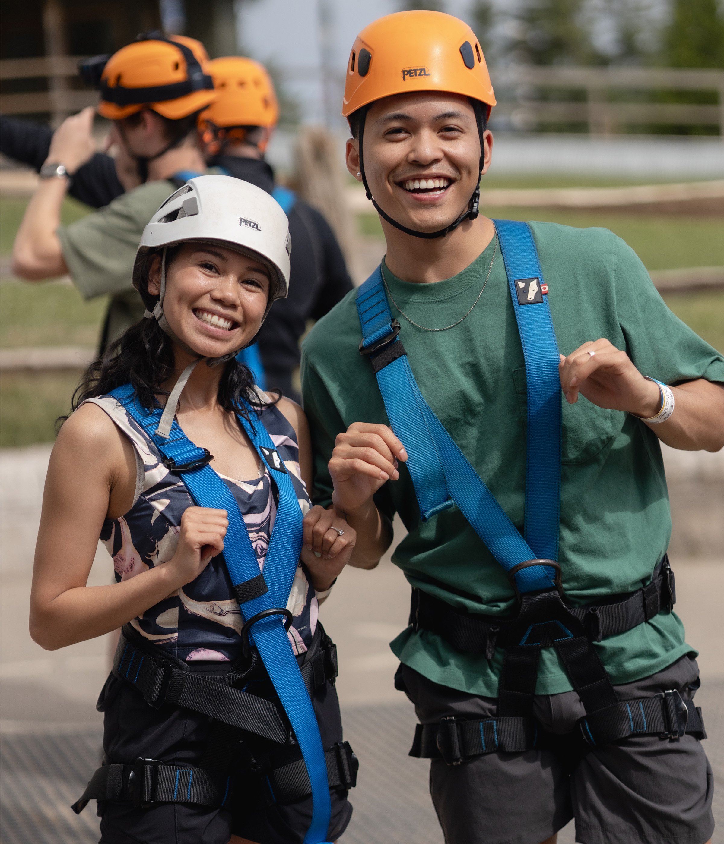 a man and woman wearing safety harnesses