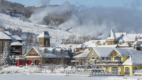 View of Blue Mountain Village in the winter while the snow guns are on