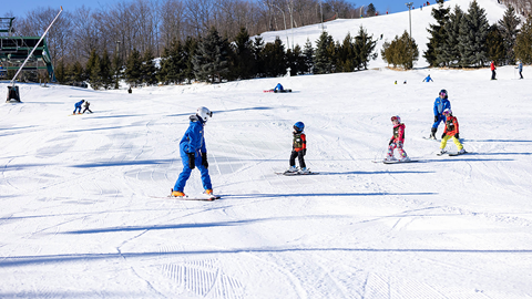 group of kids in a ski lesson at blue mountain resort located on the ski school webpage