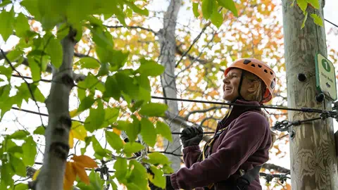 Woman at Blue Mountain on Timber Challenge Course
