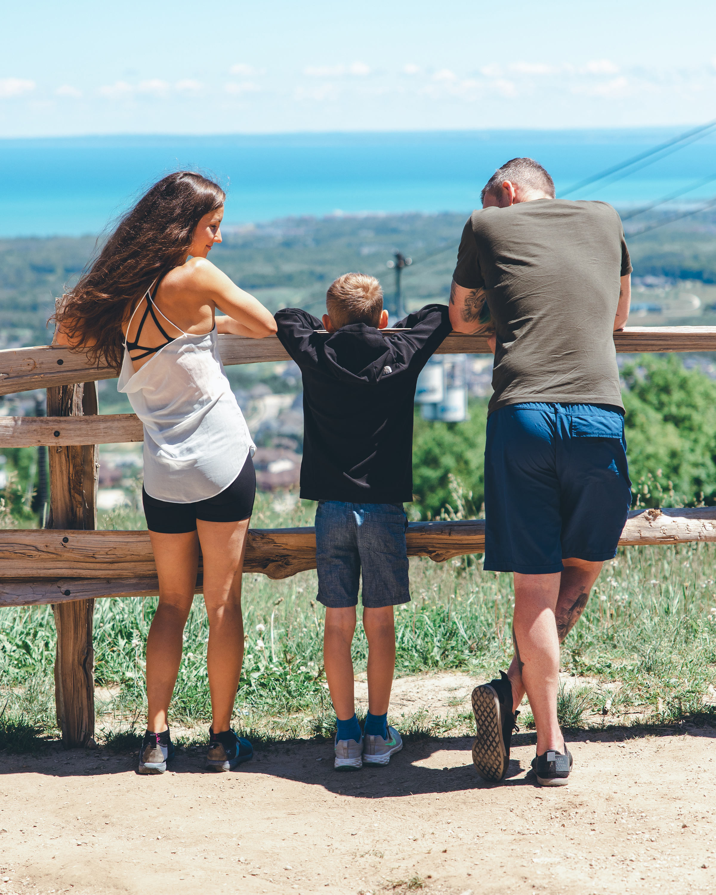 A family Looking Out at the top of Blue Mountain