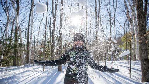 A person enjoying the snow at the Blue Mountain Resort