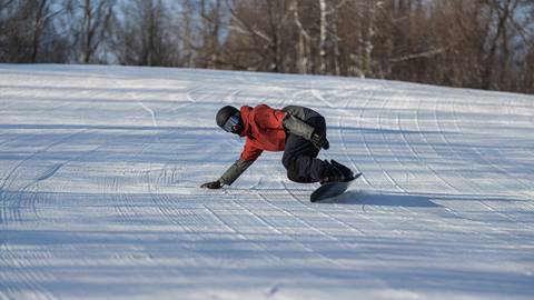 a man snowboarding at Blue Mountain Resort