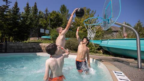 Group of kids playing basketball at the Plunge! Aquatic Centre