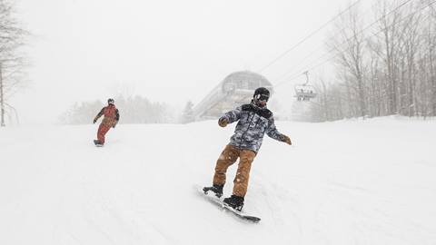 Two People Snowboarding on the slopes at Blue Mountain Resort