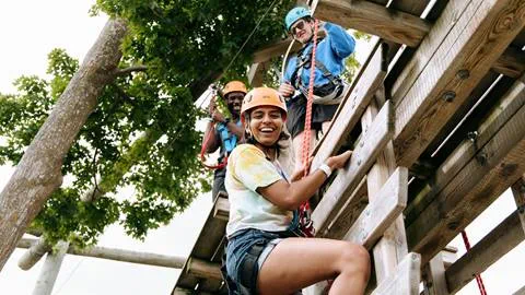A group of people on a ropes course.