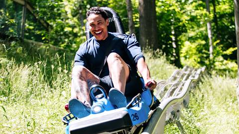 A man enjoying a thrilling ride on Ridge Runner at Blue Mountain Resort