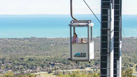 A women and a kid on the Gondola at Blue Mountain