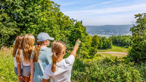 Group of kids enjoying the hiking trail and pointing at the views at Blue Mountain Resort