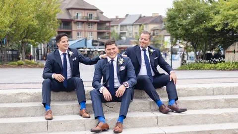 3 men waiting at off piste for wedding