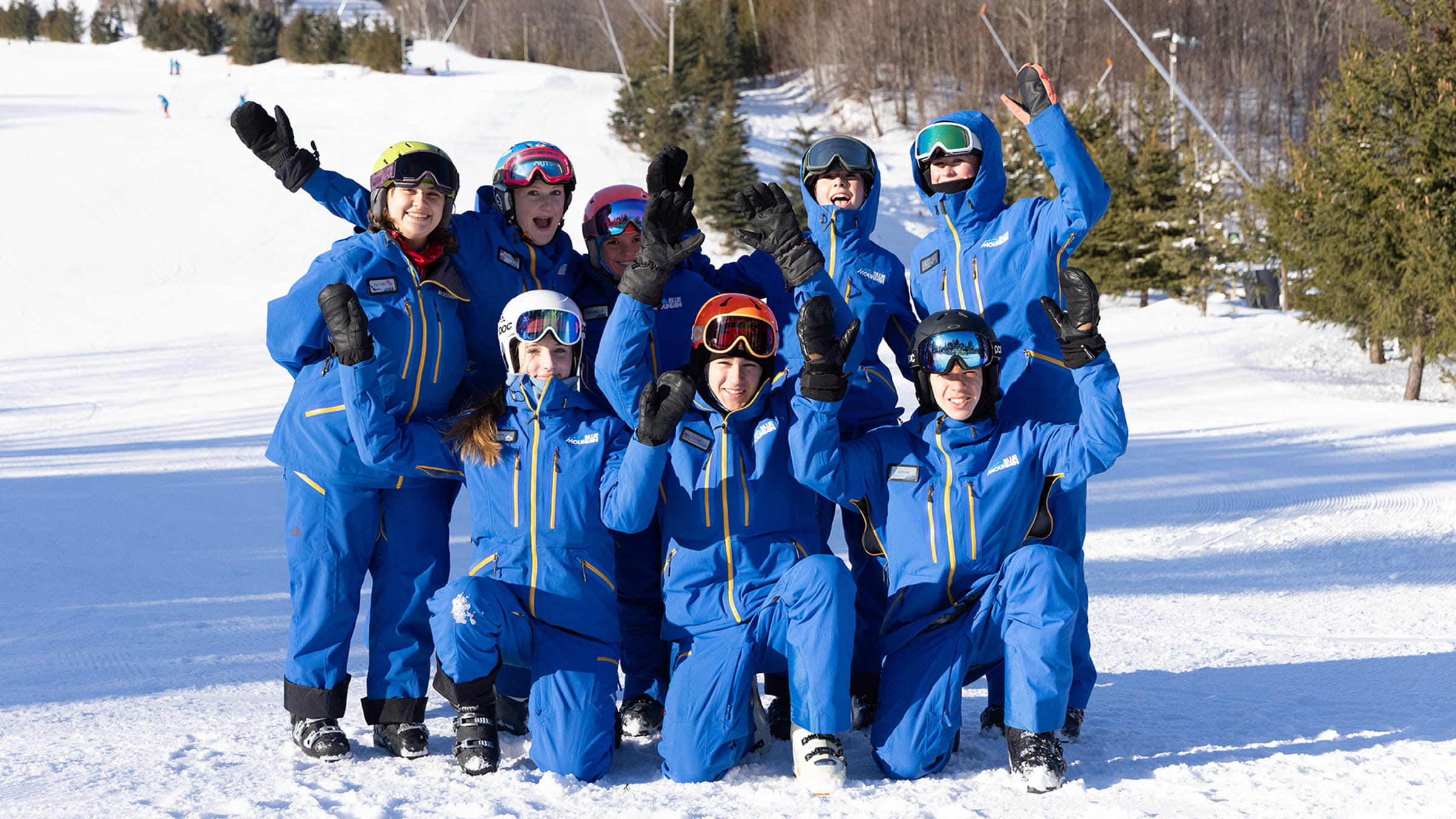 A group of people posing for a photo in the snow.
