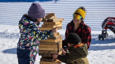 A group of people playing with blocks.