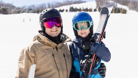 father and son skiing at blue mountain