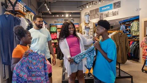 A family enjoying shopping in the Columbia store at Blue Mountain 