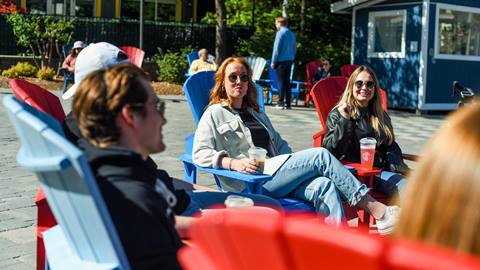 A group of people sitting in chairs.