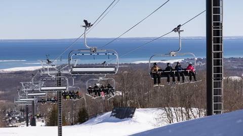 People sitting on the lift at Blue Mountain