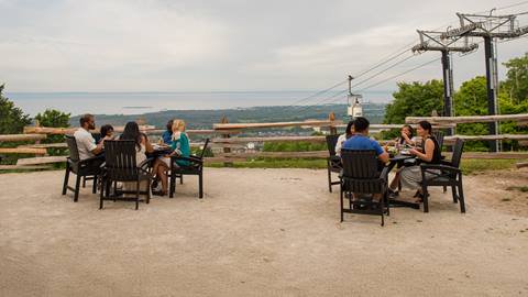 a group of people sitting on a bench