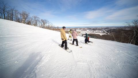 a group of people skiing on the snow