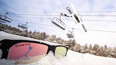 a skier jumping over the giant SMITH Sunglasses in the Badlands Terrain Park