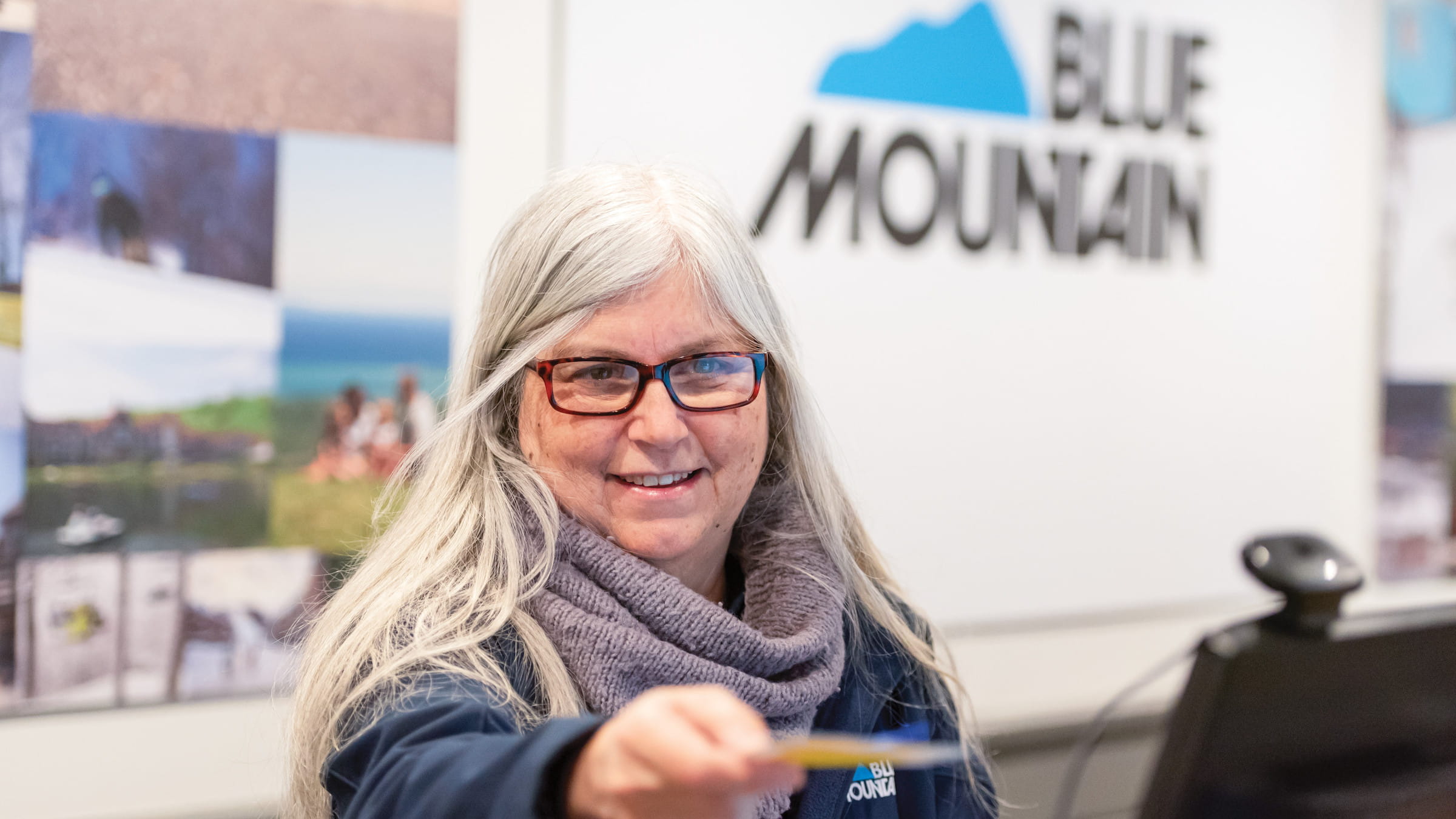 Blue Mountain Employee handing over a lift ticket at Blue Mountain