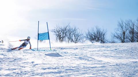 a boy skiing a GS race course