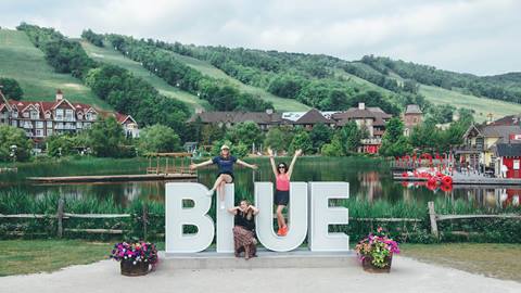 Group of friends having fun at Blue Mountain with hotel deals and discounts