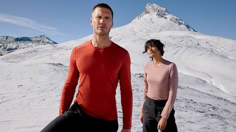 image of a man and women with a snowy mountain in the background