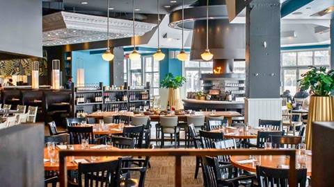 The table and chair layouts of the restaurant at Oliver & Bonacini Cafe Grill