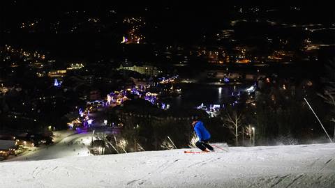Person Skiing down slopes at Blue Mountain Night Skiing