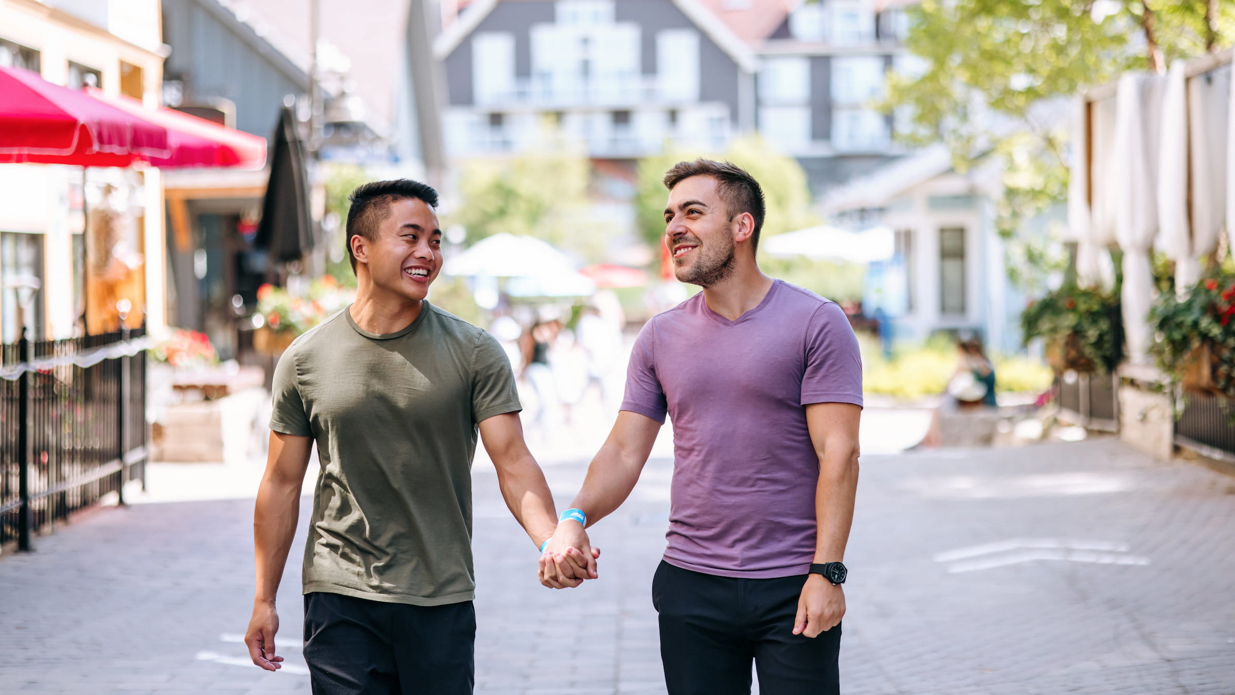 Couple walking through pedestrian village at blue mountain