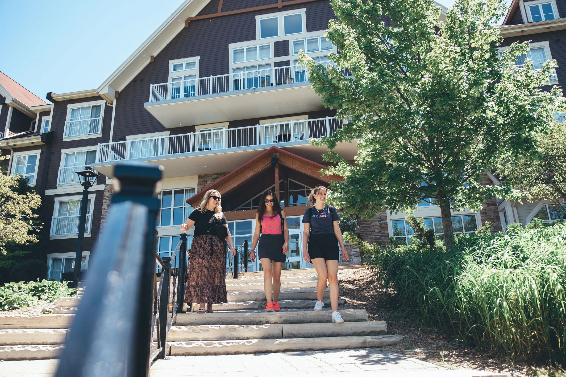 Group of friends walking down staircase at Blue Mountain to a day of adventre