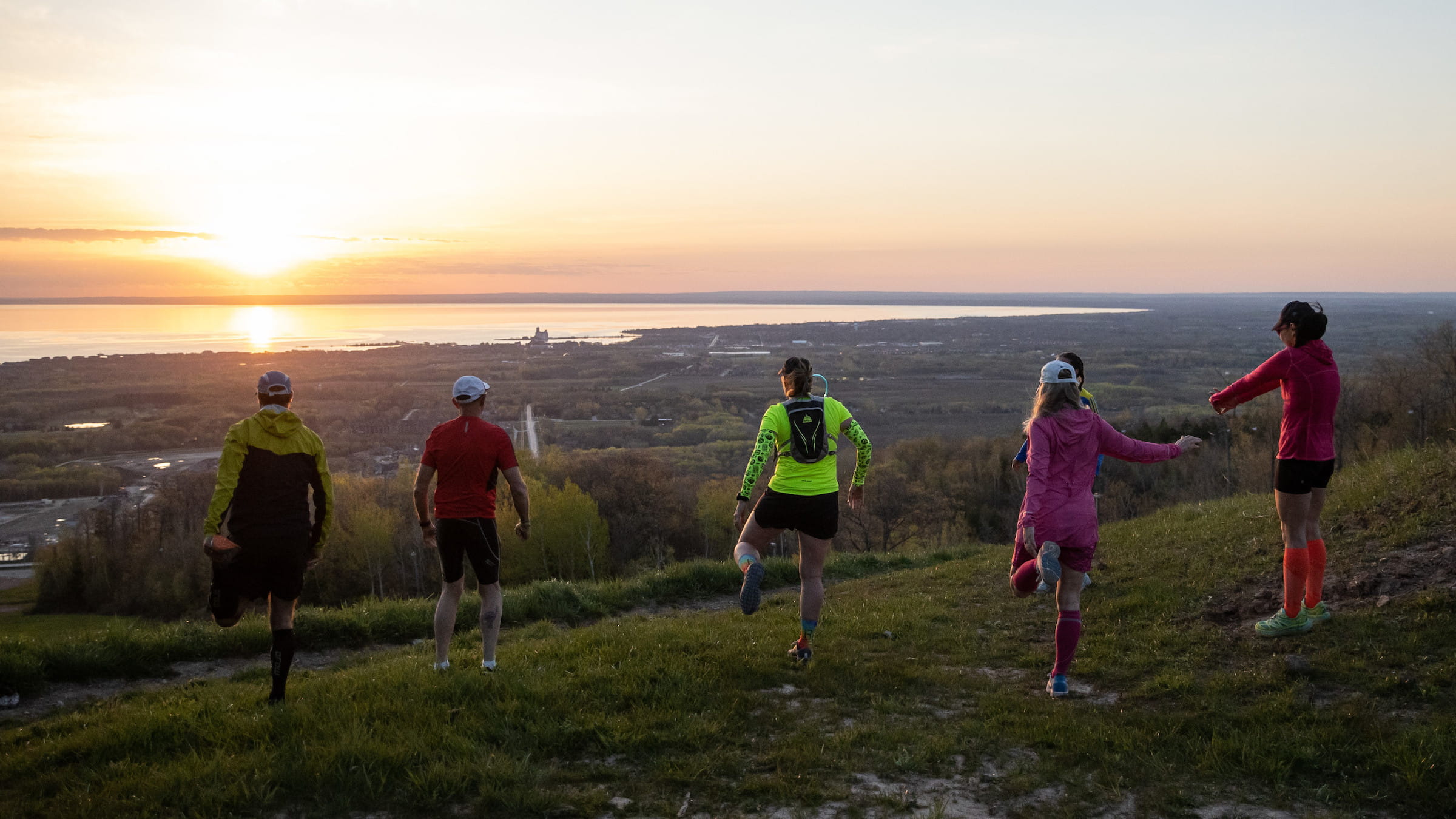 Group of Hikers Stretching on the top of Blue Mountain overlooking Georgian Bay