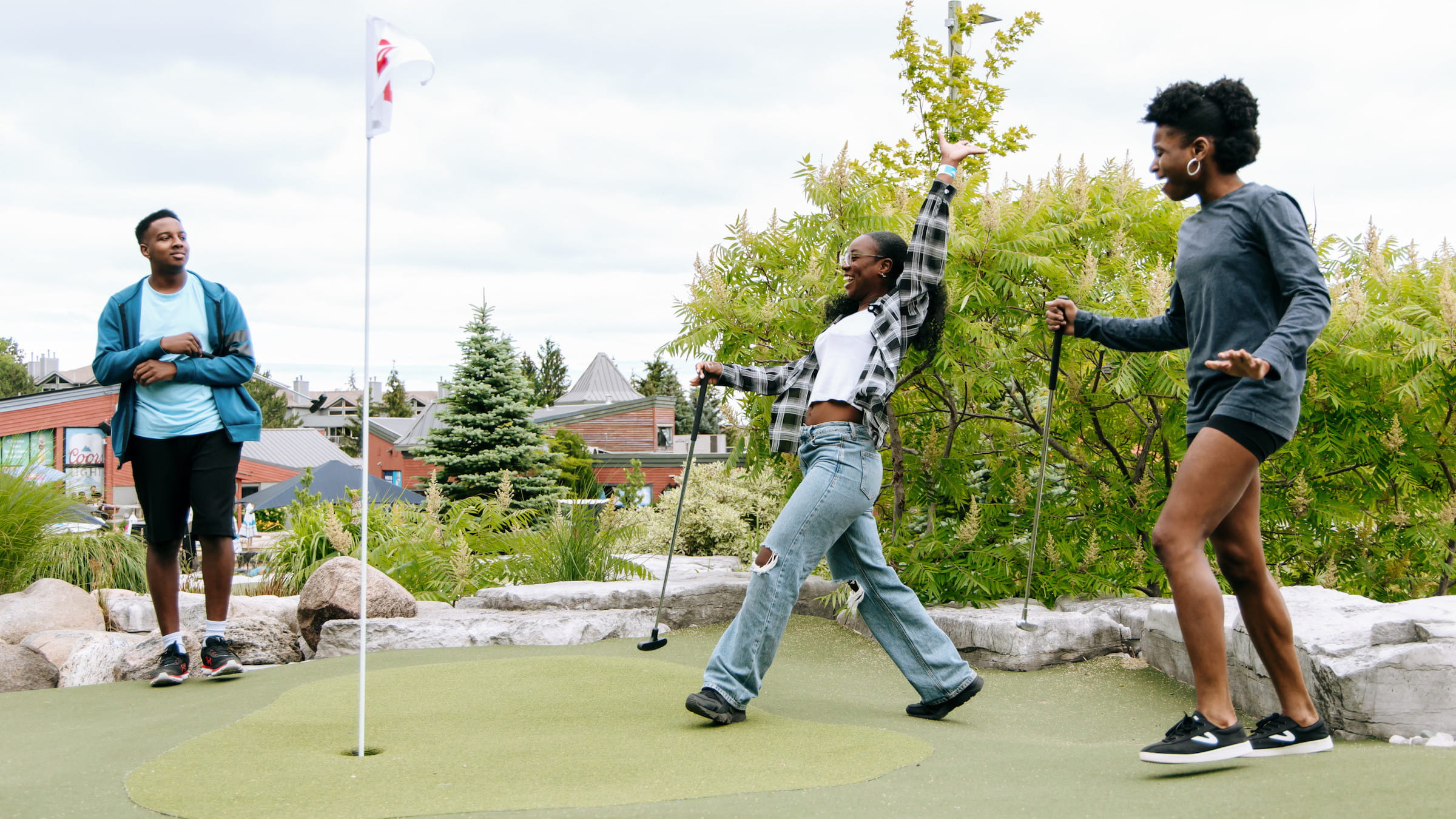 Group of friends playing mini golf at Blue Mountain