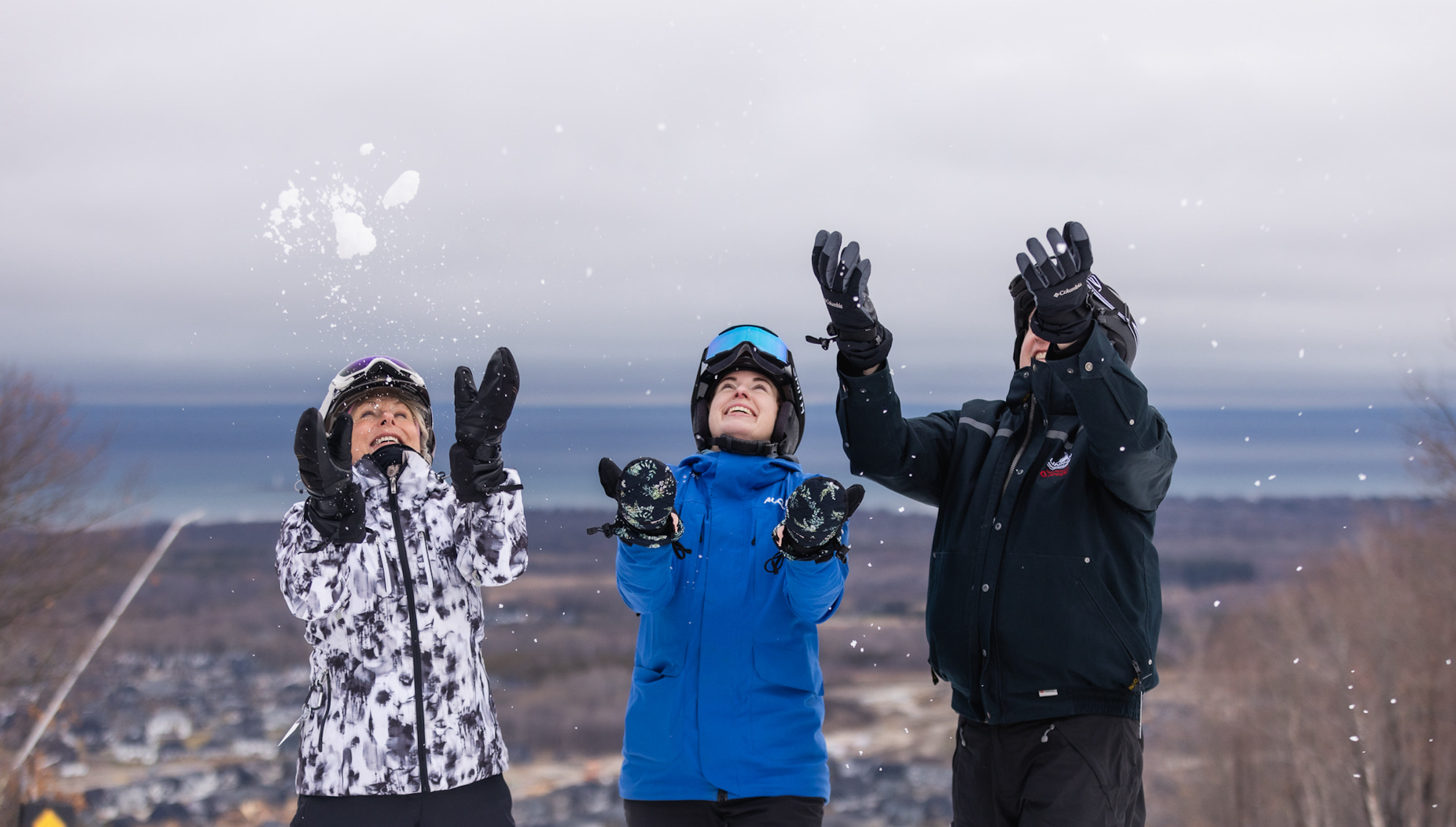 Three friends at the top of Blue Mountain enjoying multi-week skiing at Blue Mountain
