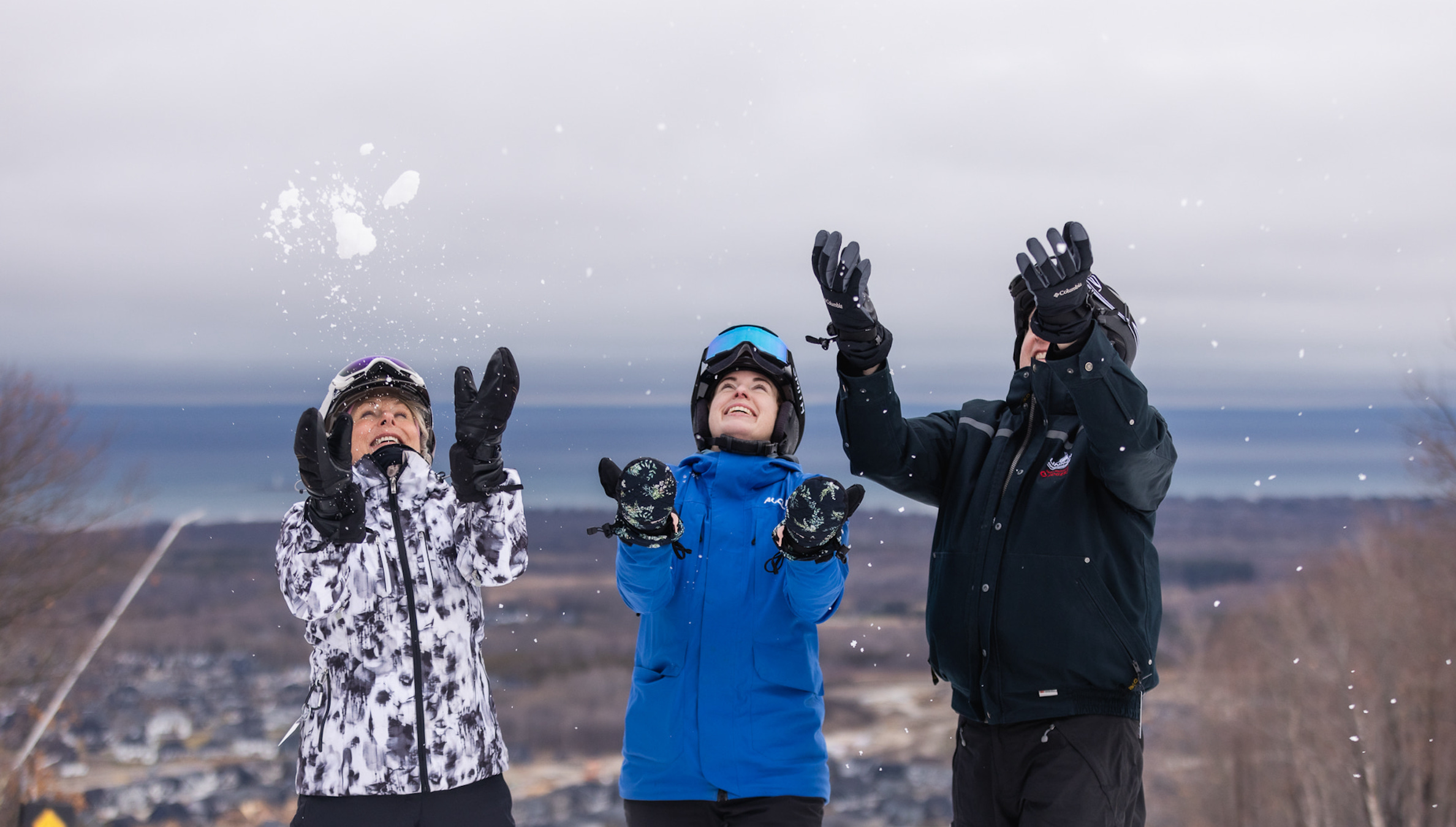 Three friends at the top of Blue Mountain enjoying multi-week skiing at Blue Mountain