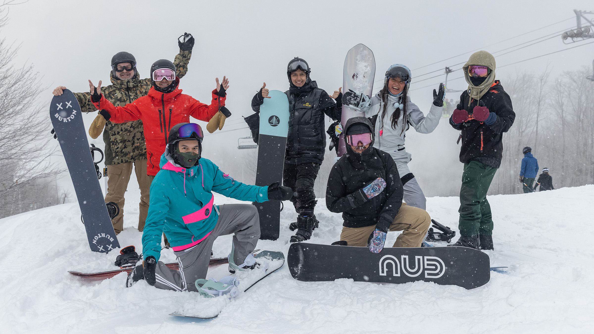 Group of 5x7® Pass holders cheering in excitement at the top of the run at Blue Mountain Resort