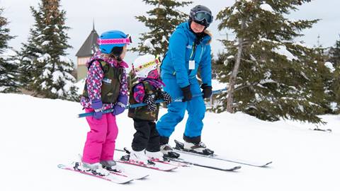 Small children with instructor at Kids Group Ski Lesson Blue Mountain