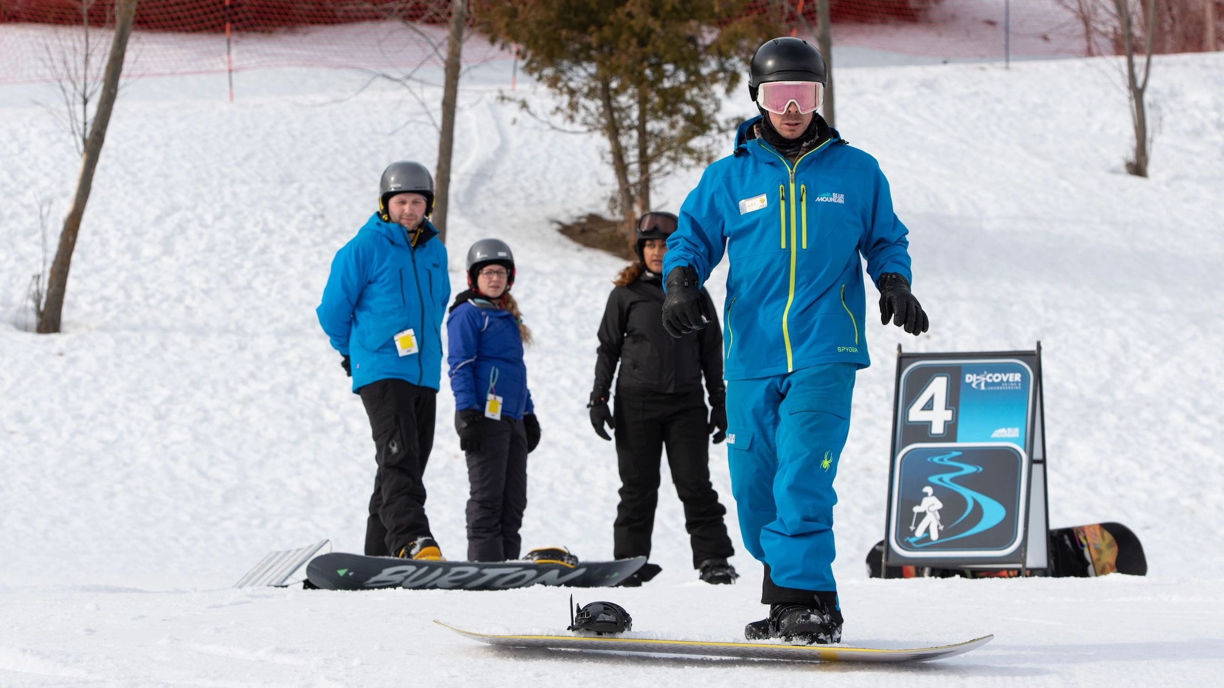 New Snowboarder with instructor during Beginner Snowboard Lessons at Blue Mountain