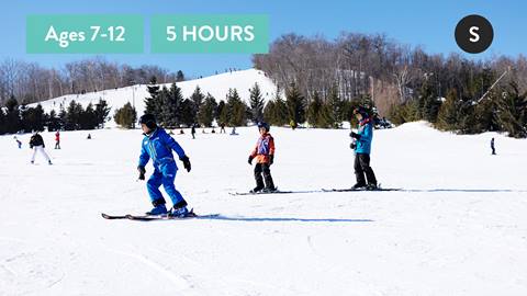 Children on magic carpet during Kids Daily Snowboard Lessons Blue Mountain