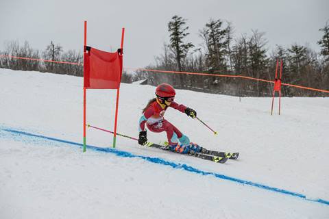 Skier racing during U10 Race Program at Blue Mountain