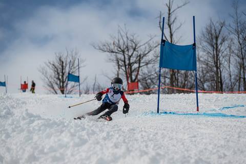 Skier racing during U12 Race Program at Blue Mountain