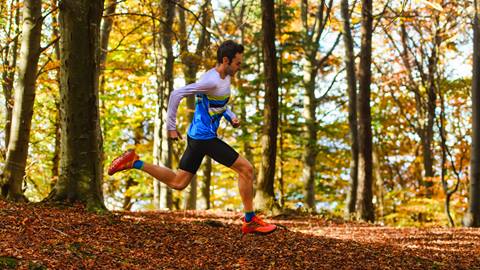 a man running in the woods