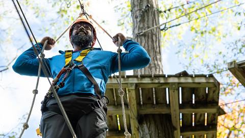 A man on the Timber Challenge High Ropes