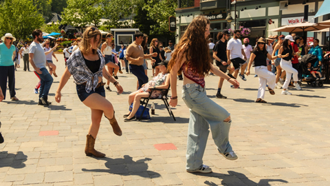 a group of people dancing in the Blue Mountain Village