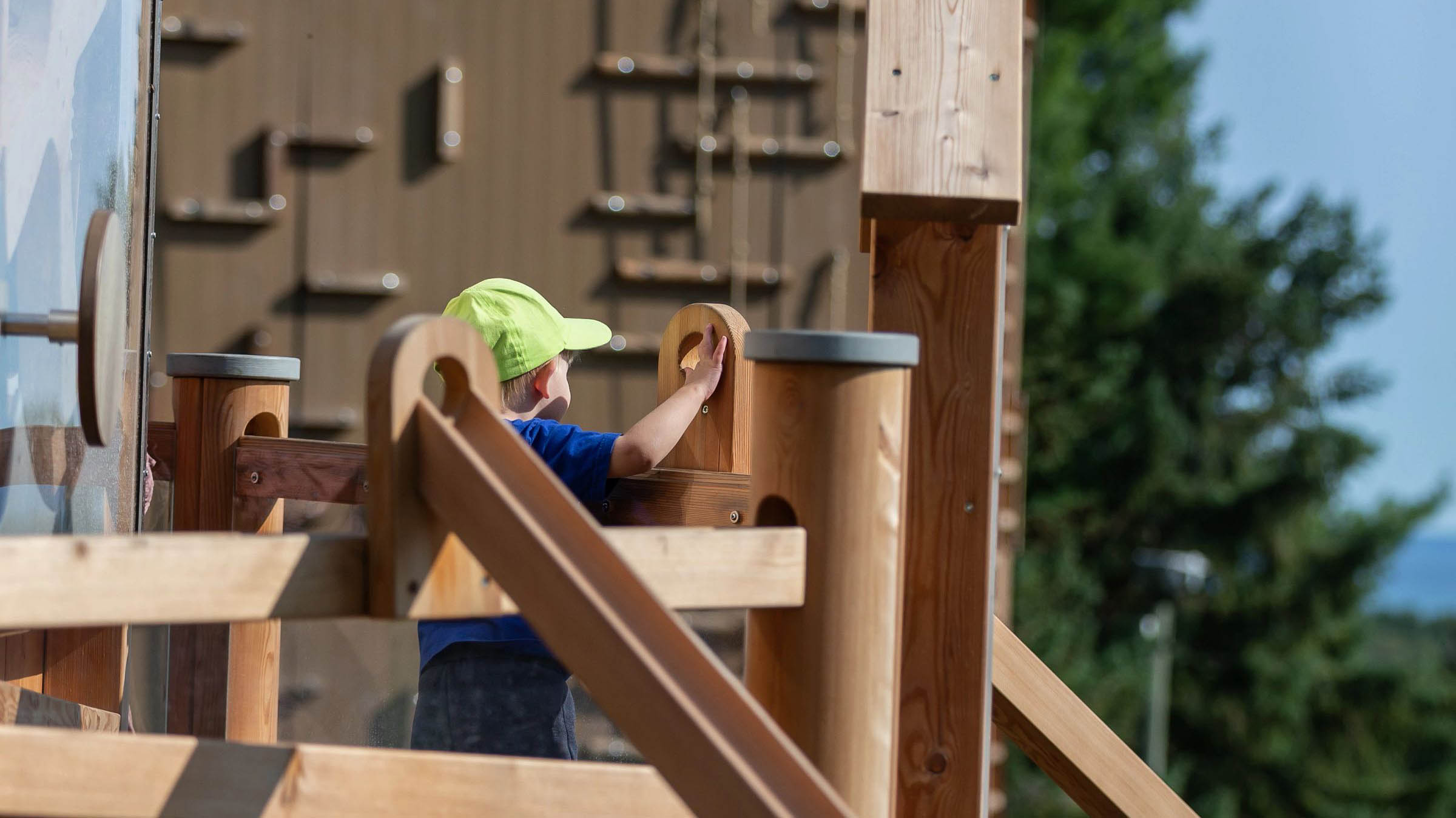 kid playing on Chutes and Loops Play Structure Ball run at Blue Mountain
