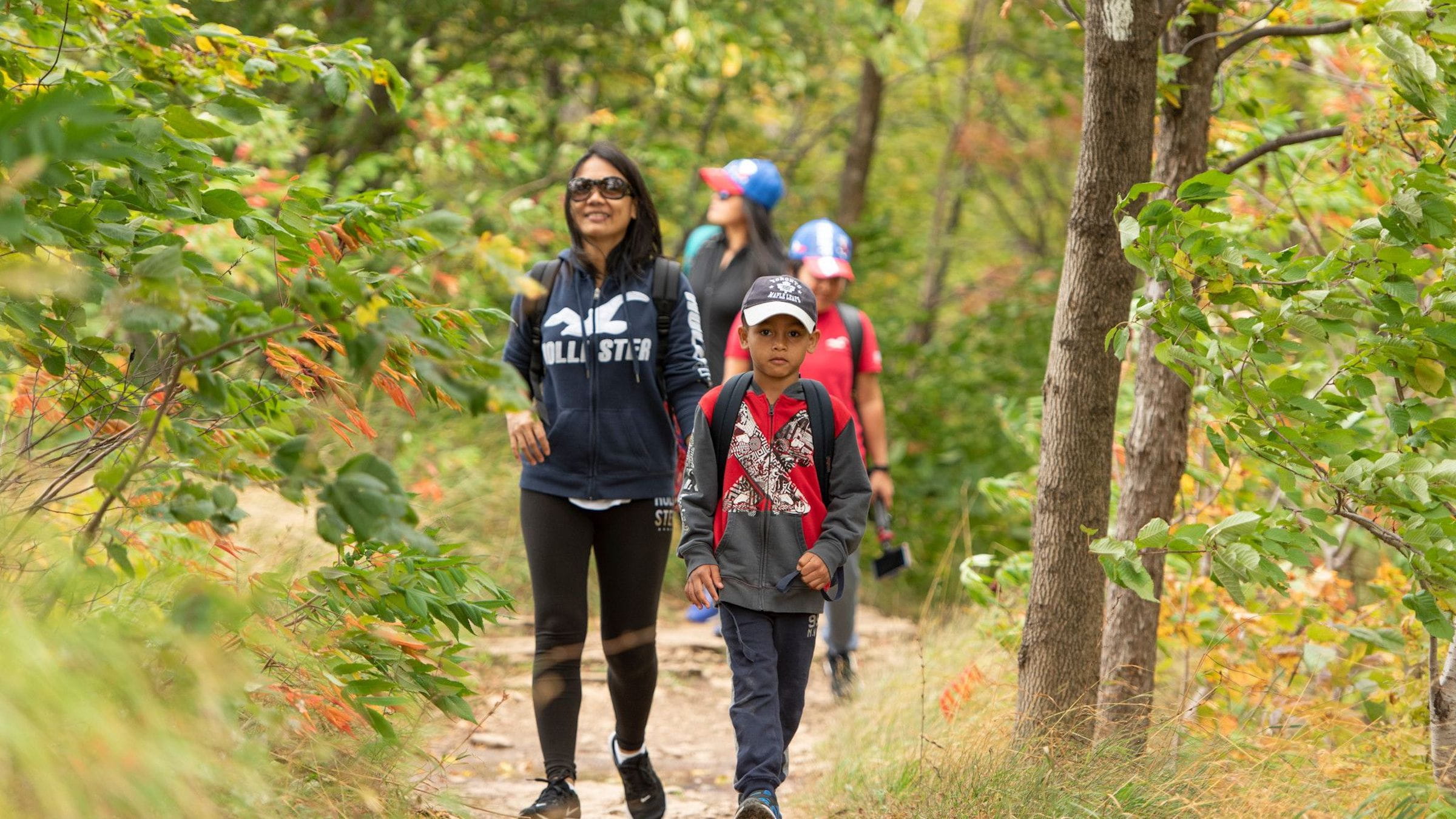 Family hiking through the explore park at Blue moutain