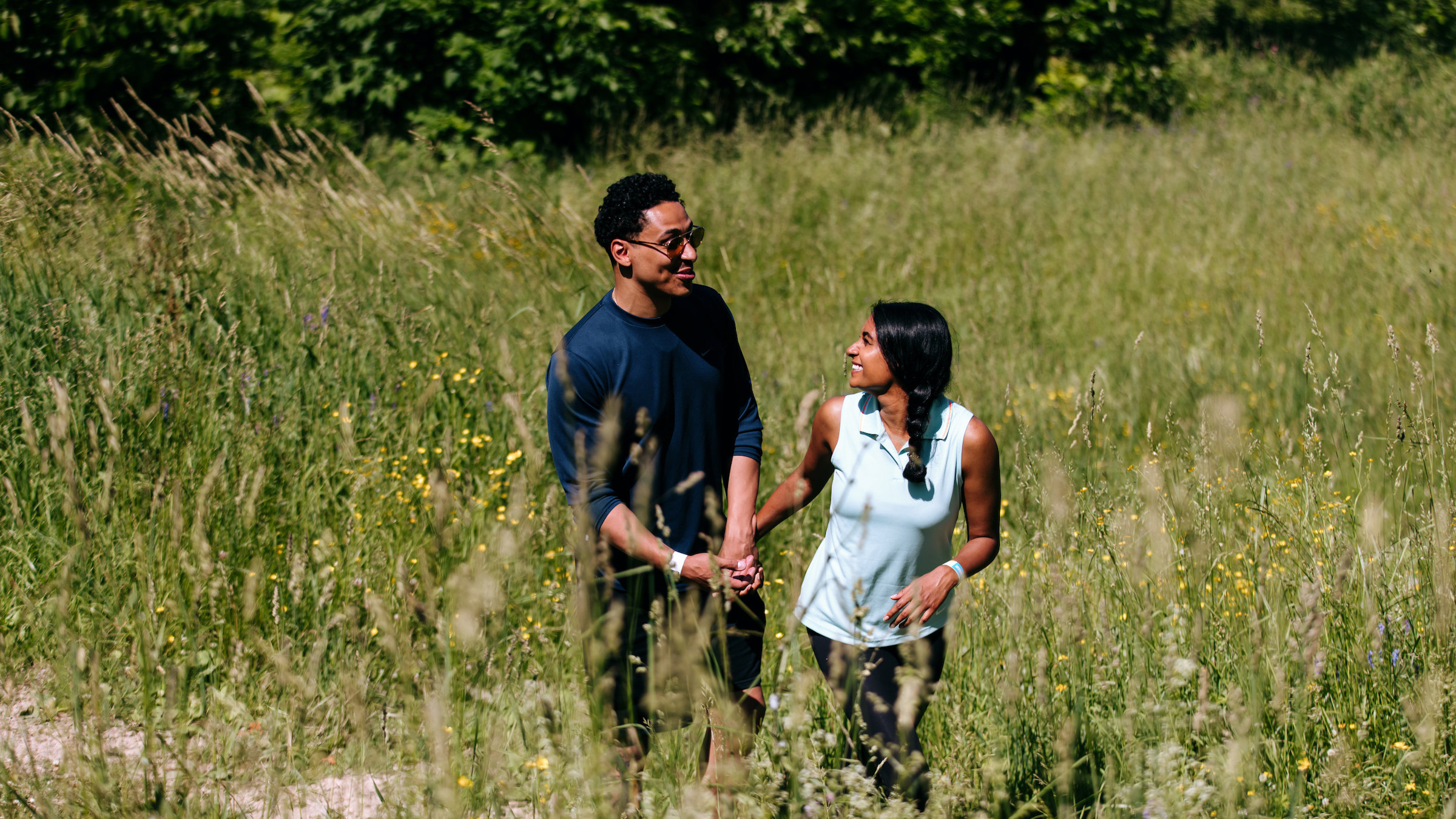 couple holding hands during hike in the Explore Park at Blue Mountain