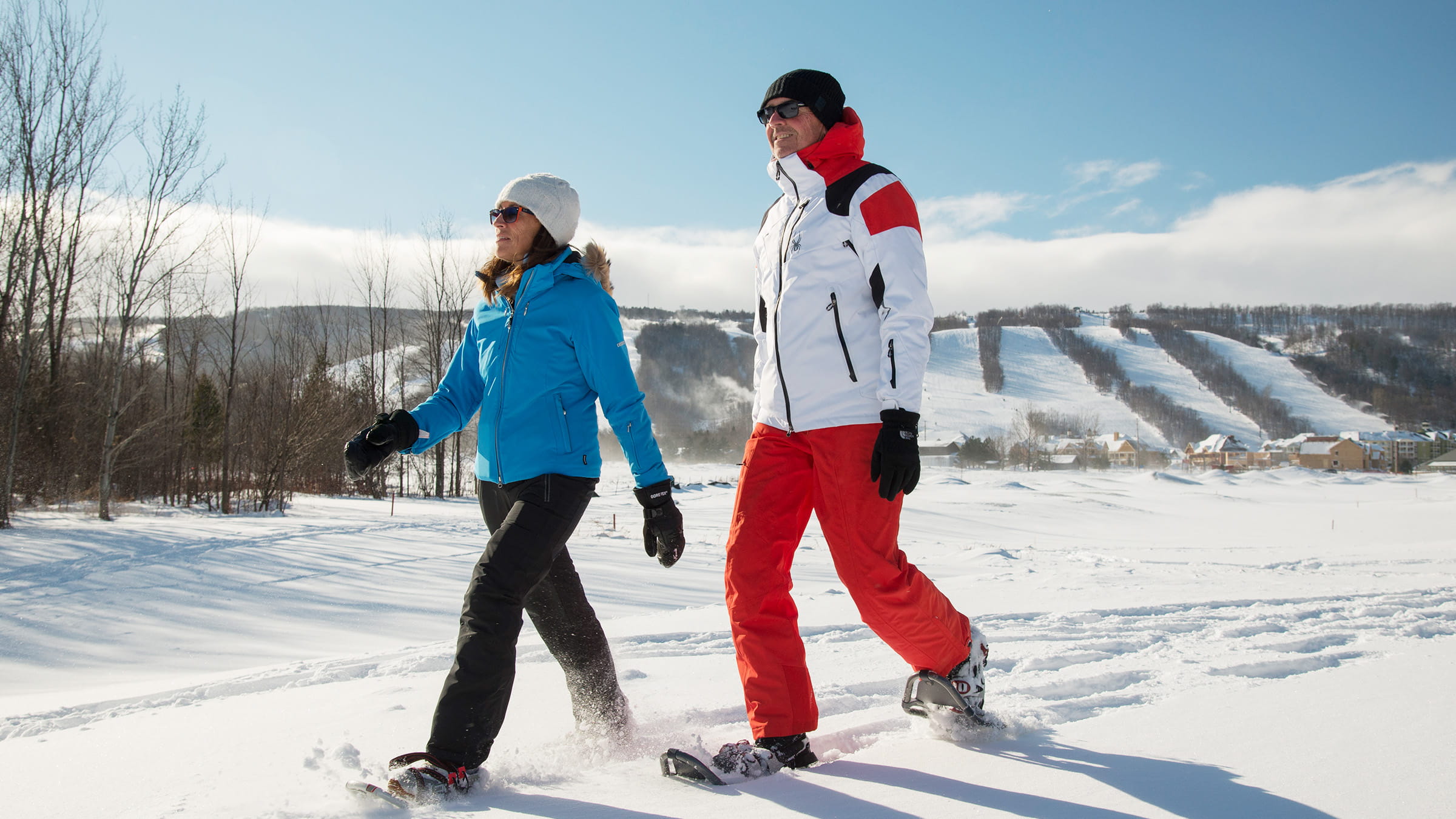 People in snowshoes walking along Blue Mountain trail access